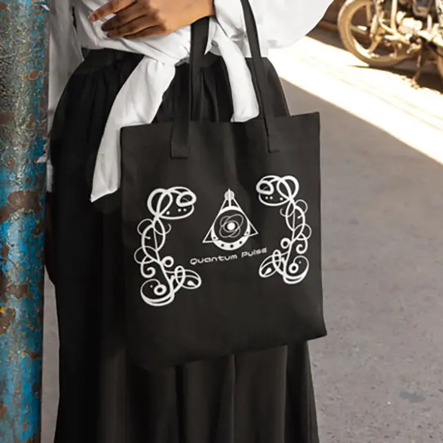 Durable black canvas tote bag featuring the white Quantum Pulse logo and decorative music-inspired graphics.